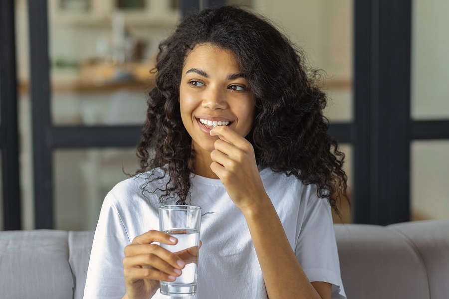 Woman taking supplements